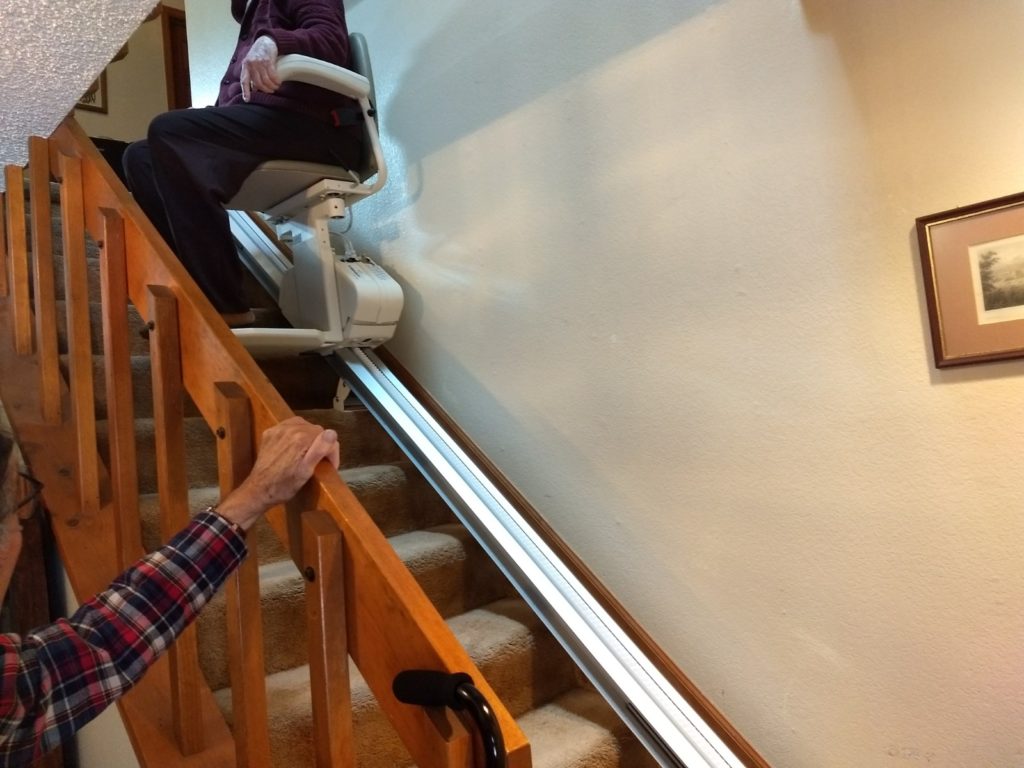 Person Riding a Stairlift- Colorado Springs, CO